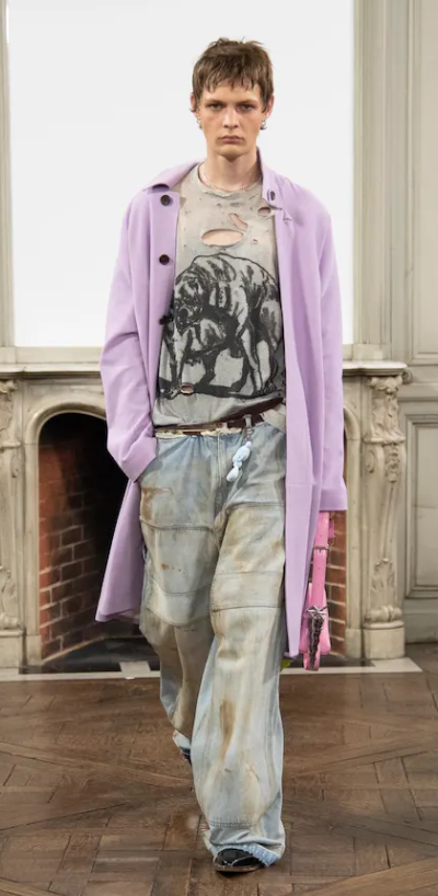 A man wearing a Sankuanz outfit in violet and jeans