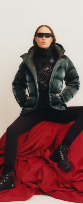 A woman wearing a black Aritzia jacket