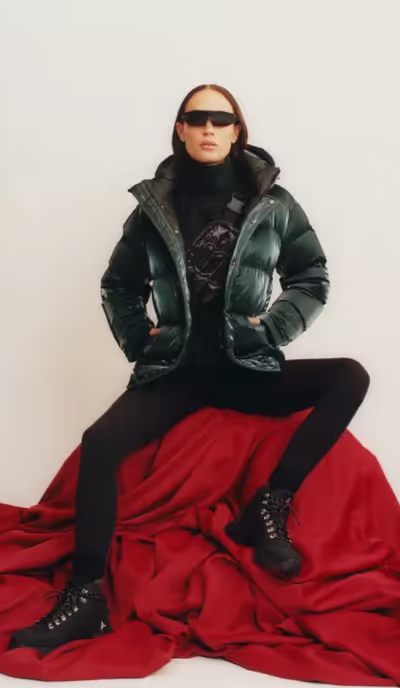 A woman wearing a black Aritzia jacket