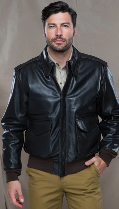 A man wearing a Cockpit USA military jacket and brown pants