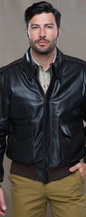 A man wearing a Cockpit USA military jacket and brown pants