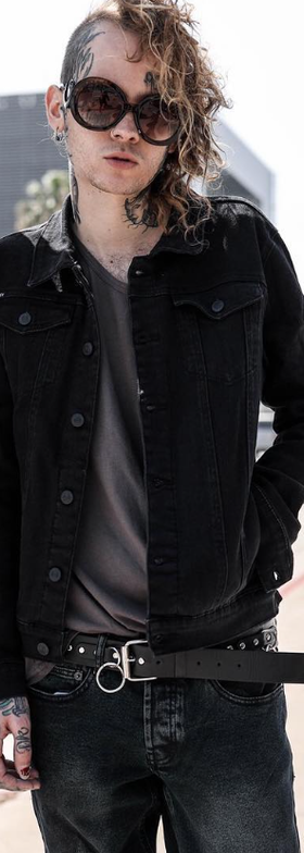 A man wearing an Iron Fist black outfit