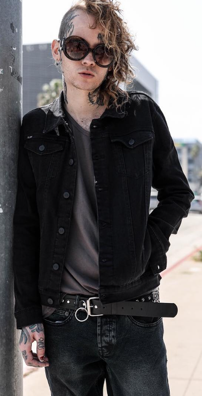 A man wearing an Iron Fist black outfit