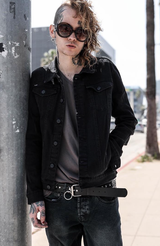 A man wearing an Iron Fist black outfit