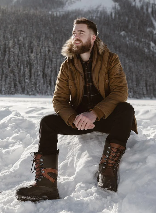 A man wearing a pair of Baffin Boots in the snow