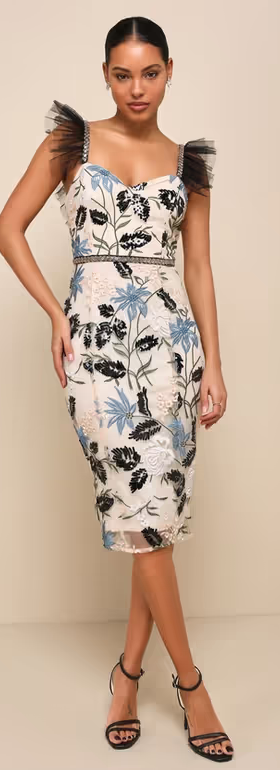 A woman wearing a Lulus floral dress in blue and white