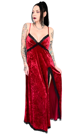 A woman wearing a gothic red FoxBlood Clothing dress
