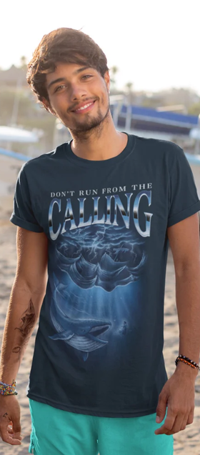 A man wearing a Sek Apparel navy blue t-shirt