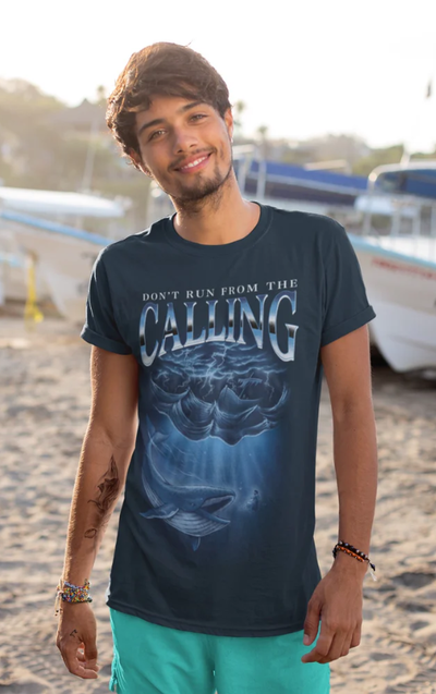 A man wearing a Sek Apparel navy blue t-shirt