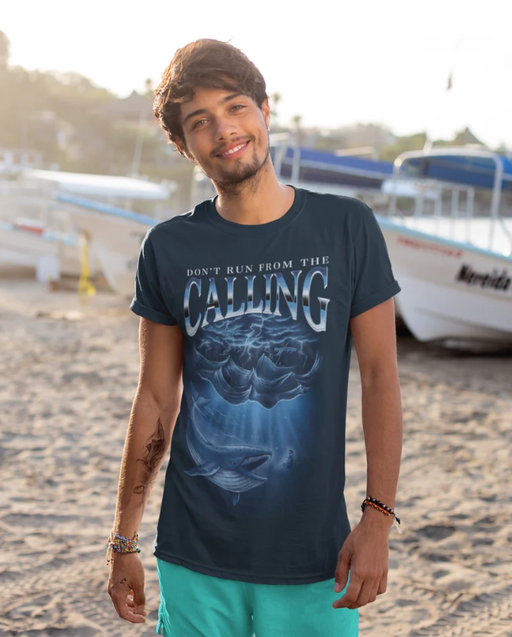 A man wearing a Sek Apparel navy blue t-shirt