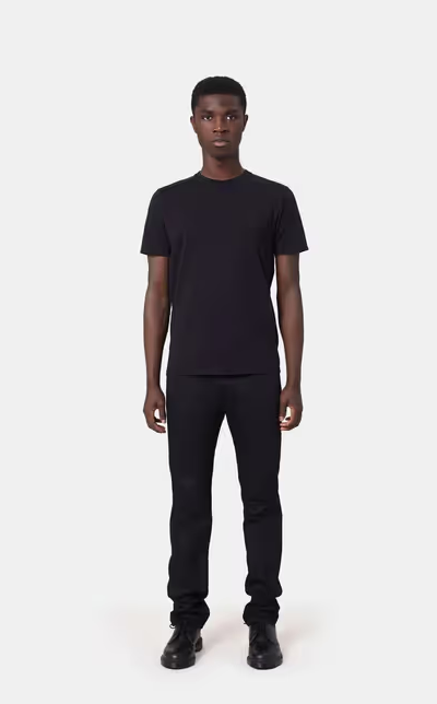 A man wearing a Colorful Standard deep black t-shirt