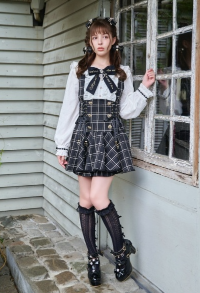 A woman wearing a Liz Lisa black and white dress