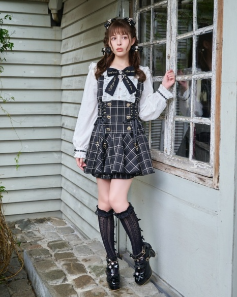 A woman wearing a Liz Lisa black and white dress