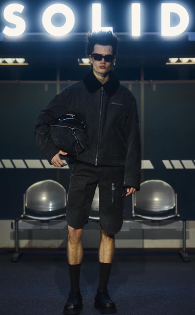 A man wearing a Cutler and Gross Glasses black sunglass