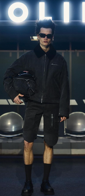 A man wearing a Cutler and Gross Glasses black sunglass