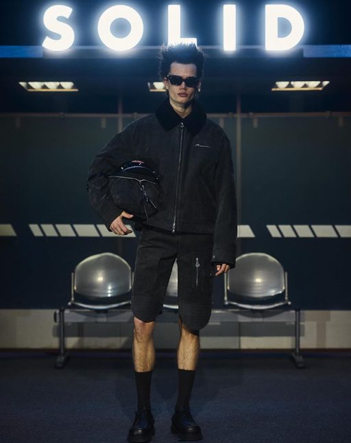 A man wearing a Cutler and Gross Glasses black sunglass