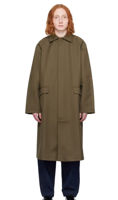 A man wearing a Cordera khaki long trench coat
