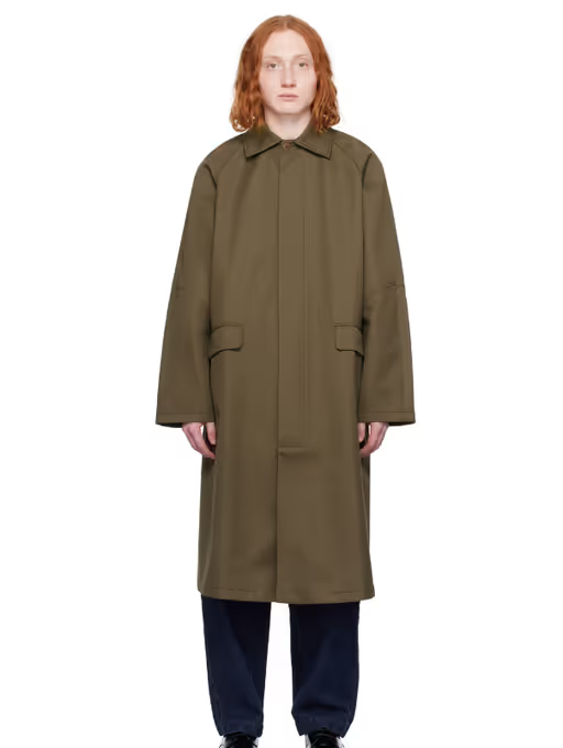 A man wearing a Cordera khaki long trench coat