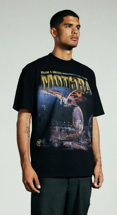 A man wearing a Hypland front printed black t-shirt