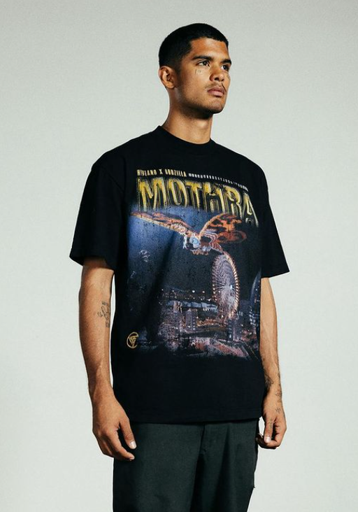 A man wearing a Hypland front printed black t-shirt