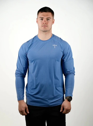 A man wearing a HolStrength lightweight long sleeve tee - light blue