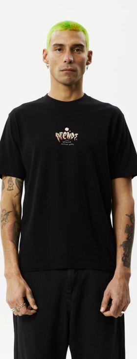 A man wearing a Afends retro fit black t-shirt
