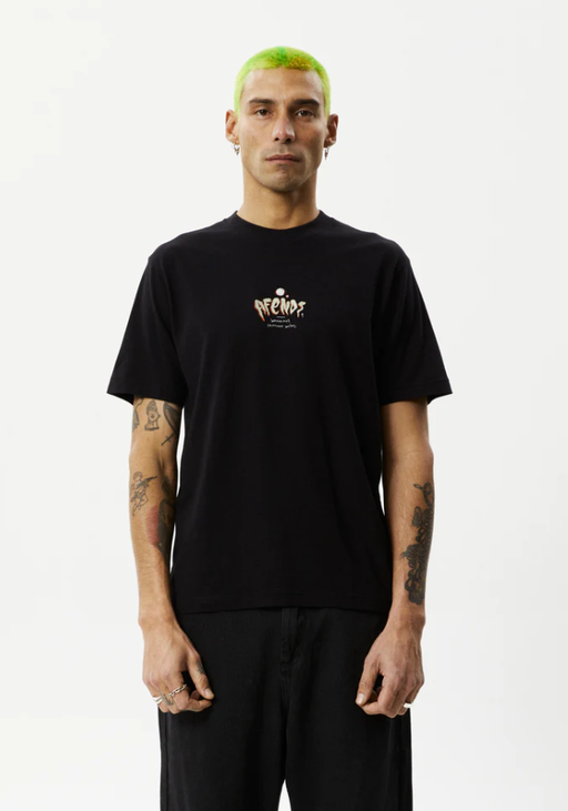A man wearing a Afends retro fit black t-shirt