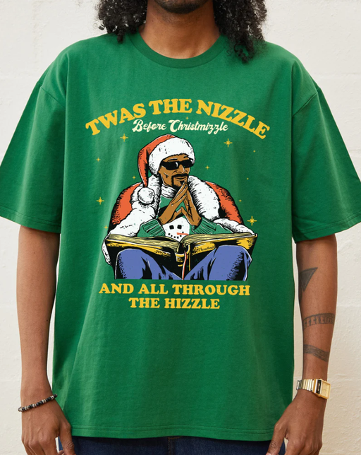 A man wearing a Threadheads green christmizzle dogg t-shirt