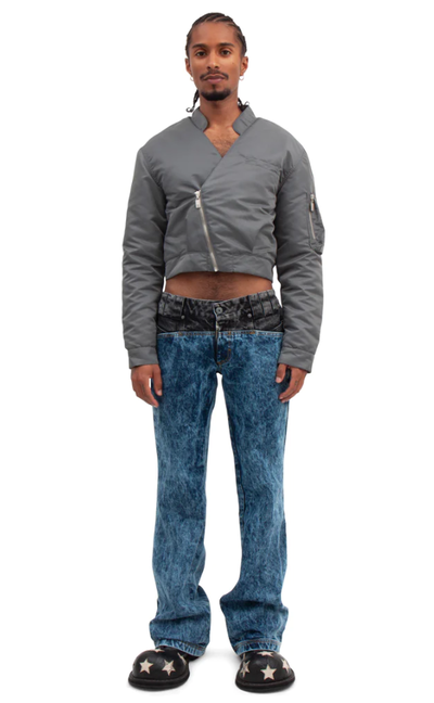A man wearing a BARRAGÁN gun metal gray crop bomber blazer