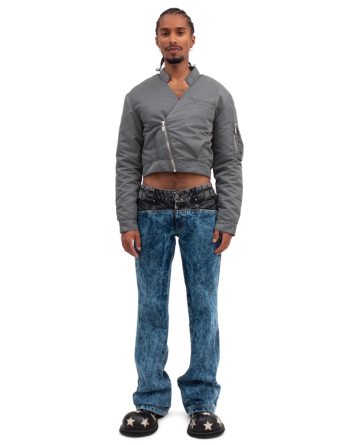 A man wearing a BARRAGÁN gun metal gray crop bomber blazer