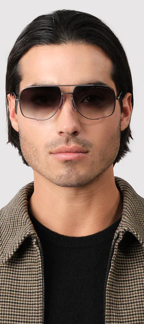 A man wearing a Dita Eyewear grey to clear gradient sunglass