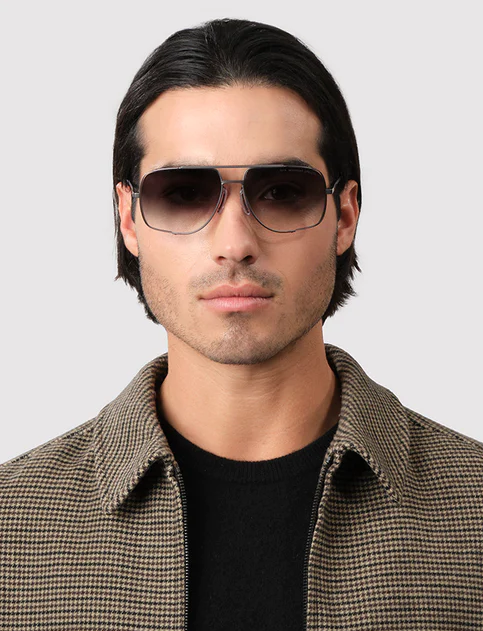 A man wearing a Dita Eyewear grey to clear gradient sunglass