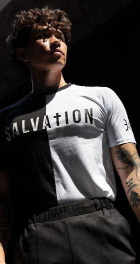 A man wearing a  3:16 Collection black and white t-shirt