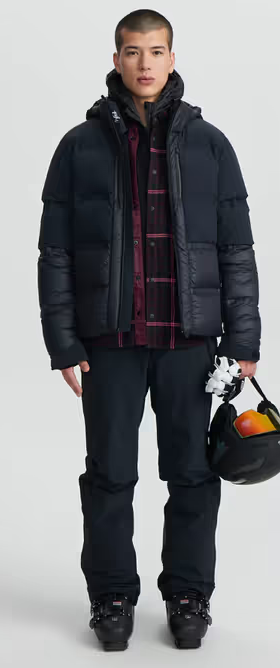 A man wearing a Aztech Mountain space black ski jackets