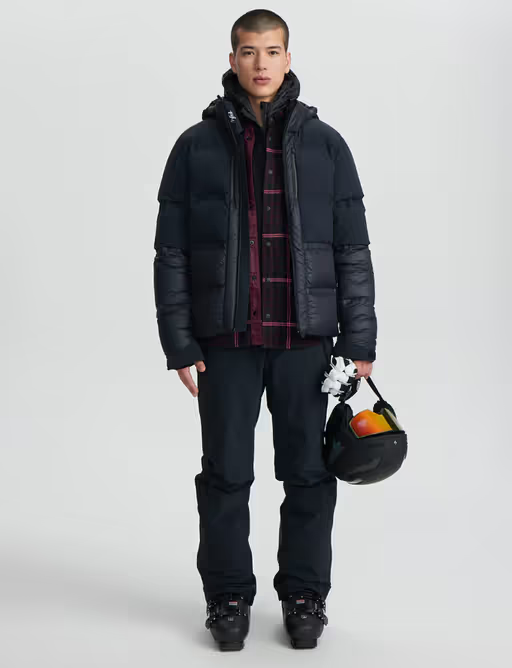 A man wearing a Aztech Mountain space black ski jackets