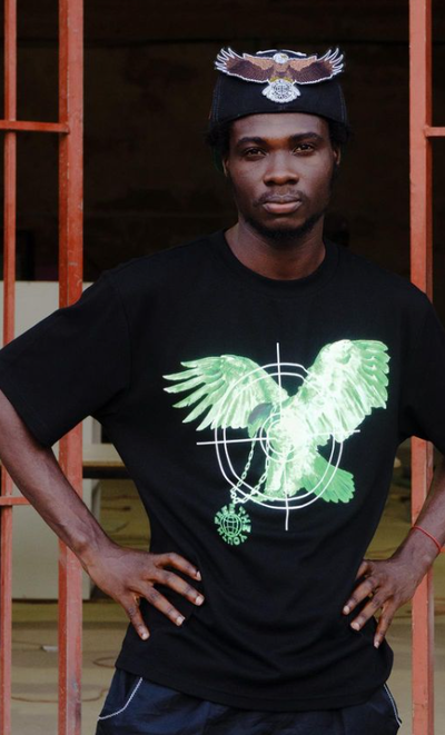 A man wearing a Free the Youth black t-shirt