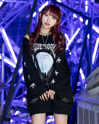 A woman wearing a Listen Flavor black pullover t-shirt