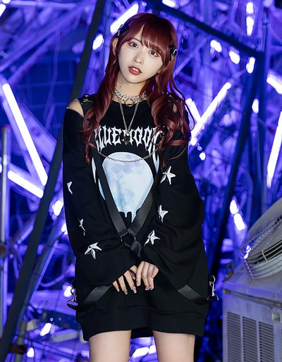 A woman wearing a Listen Flavor black pullover t-shirt