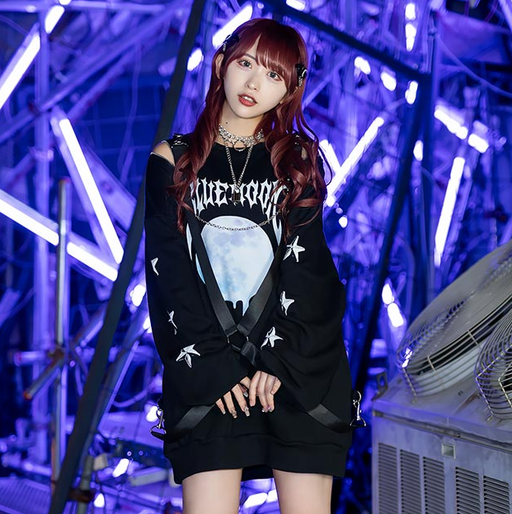 A woman wearing a Listen Flavor black pullover t-shirt