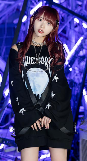 A woman wearing a Listen Flavor black pullover t-shirt