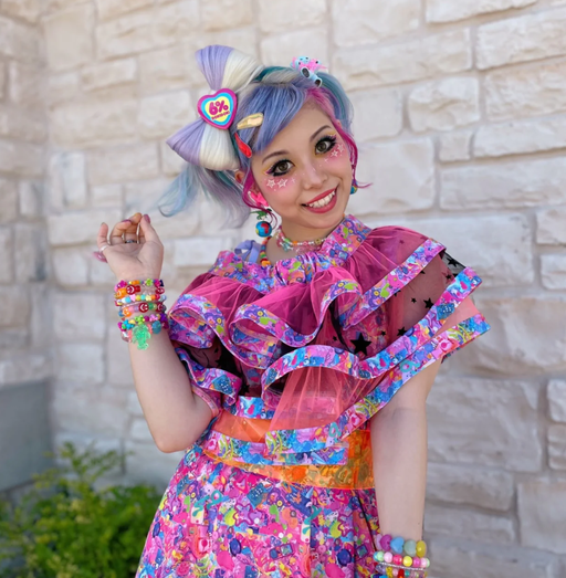 A woman wearing a 6%DOKIDOKI babydoll dress