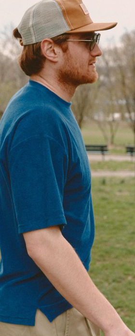 A man wearing a Battenwear navy t-shirt