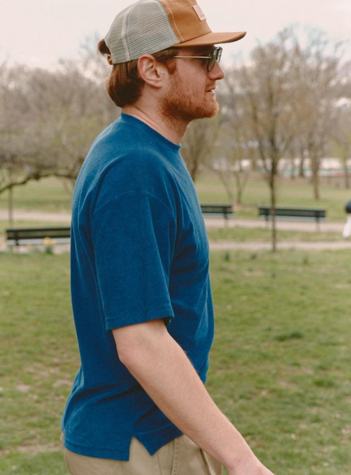 A man wearing a Battenwear navy t-shirt