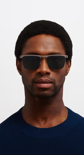A man wearing a MYKITA Eyewear ocean blue sunglass
