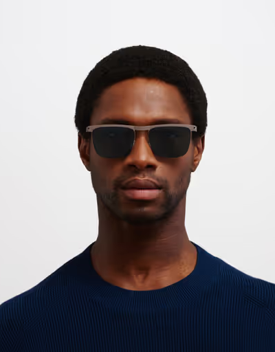 A man wearing a MYKITA Eyewear ocean blue sunglass