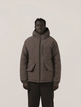 A man wearing a Satta charcoal maji jacket
