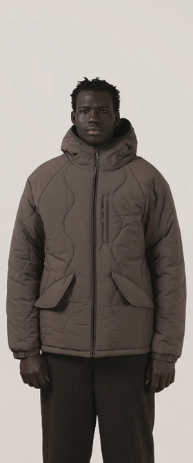 A man wearing a Satta charcoal maji jacket