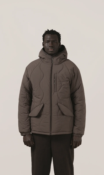 A man wearing a Satta charcoal maji jacket