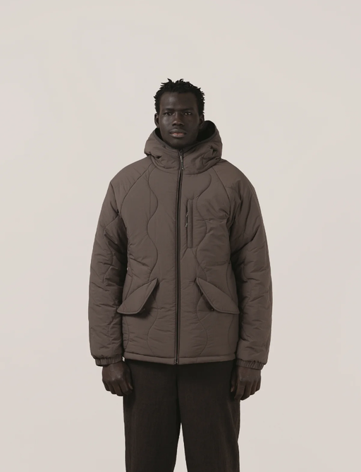 A man wearing a Satta charcoal maji jacket