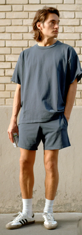 A man wearing a Gil Rodriguez washed navy dimi t-shirt